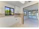 Compact kitchen with tiled backsplash, ample lighting, and open layout to other areas at 500 Park S Blvd # 97, Venice, FL 34285