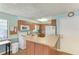 Functional kitchen with modern appliances, ample cabinet space, and a convenient breakfast bar at 500 Park S Blvd # 97, Venice, FL 34285