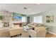 Inviting living room with comfortable seating, a decorative fireplace, and a bright, airy ambiance at 500 Park S Blvd # 97, Venice, FL 34285
