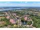 Scenic aerial view of residential community with lush landscaping, water features, and tile roofs at 5001 Baraldi Cir # 22-202, Sarasota, FL 34235