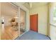 Balcony leading to an open-concept living area with wood floors and comfortable seating at 5001 Baraldi Cir # 22-202, Sarasota, FL 34235