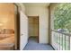 Balcony area with an outside storage closet and a sliding glass door to the interior at 5001 Baraldi Cir # 22-202, Sarasota, FL 34235