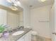 Bathroom with granite countertop and tiled floors at 5001 Baraldi Cir # 22-202, Sarasota, FL 34235
