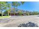 Charming townhomes with red tile roofs, attached garages and well-maintained landscaping at 5001 Baraldi Cir # 22-202, Sarasota, FL 34235