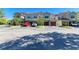 Exterior view of the building with a driveway and parking spaces at 5001 Baraldi Cir # 22-202, Sarasota, FL 34235
