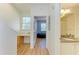 Hallway leading to the bedroom and bathroom at 5001 Baraldi Cir # 22-202, Sarasota, FL 34235