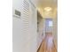 Hall laundry room with white washer and dryer and a set of white doors and closet at 5001 Baraldi Cir # 22-202, Sarasota, FL 34235
