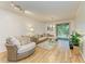 Inviting living room features a comfortable sectional sofa, natural light, and seamless access to the outdoors at 5001 Baraldi Cir # 22-202, Sarasota, FL 34235