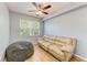 Living room area with hardwood floors, a couch, and a bean bag at 5001 Baraldi Cir # 22-202, Sarasota, FL 34235