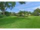 Beautiful landscaping is displayed in the front yard of this well-maintained home at 5012 Cherry Laurel Way, Sarasota, FL 34241