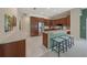 Open kitchen featuring wood cabinets, stainless steel appliances, and a breakfast bar with seating at 5012 Cherry Laurel Way, Sarasota, FL 34241