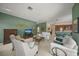 Inviting living room featuring a TV, comfortable seating, and seamless connection to the open kitchen at 5012 Cherry Laurel Way, Sarasota, FL 34241