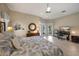 Bright main bedroom with ceiling fan, workspace and access to the backyard at 5012 Cherry Laurel Way, Sarasota, FL 34241