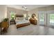 Relaxing main bedroom featuring a ceiling fan, windows with backyard view, and natural light at 5012 Cherry Laurel Way, Sarasota, FL 34241