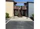 Apartment complex featuring a wooden staircase to units with private balconies at 5026 Water Oak Dr # 114, Bradenton, FL 34207