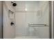 Modern walk-in shower with rain shower head and sleek grey tile at 5032 Barcelona Ave, Sarasota, FL 34235