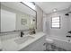 Bathroom featuring decorative tile floor, a large mirror, and a shower-tub combination at 5032 Barcelona Ave, Sarasota, FL 34235