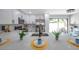 Bright kitchen featuring a marble counter, stainless steel appliances, and modern white cabinetry at 5032 Barcelona Ave, Sarasota, FL 34235