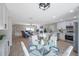 Open concept kitchen flows to dining area and living room with fireplace and modern décor at 5032 Barcelona Ave, Sarasota, FL 34235