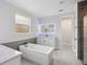 Luxurious bathroom featuring a soaking tub, double vanity, and modern finishes at 5533 Long Shore Loop, Sarasota, FL 34238