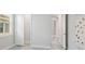 Neutral bedroom with walk-in closet and doorway to room with glass doors and backyard pool view at 5533 Long Shore Loop, Sarasota, FL 34238