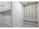 Spacious closet with ample shelving and a built-in storage unit at 5533 Long Shore Loop, Sarasota, FL 34238