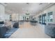 Spacious clubhouse interior featuring stylish seating areas, a kitchenette, and elegant lighting fixtures at 5533 Long Shore Loop, Sarasota, FL 34238
