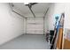 Clean and well-maintained garage with epoxy floor, a new automatic door, and ample space at 5533 Long Shore Loop, Sarasota, FL 34238