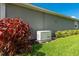 Home exterior featuring a Generac generator, providing reliable backup power for peace of mind at 5533 Long Shore Loop, Sarasota, FL 34238