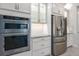 Kitchen featuring stainless steel appliances, built in oven and microwave with ample lighting at 5533 Long Shore Loop, Sarasota, FL 34238