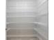 Spacious pantry with ample wire shelving for organized storage at 5533 Long Shore Loop, Sarasota, FL 34238