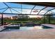 Stunning view of a private swimming pool with attached spa and water features overlooking a picturesque landscape at 5533 Long Shore Loop, Sarasota, FL 34238