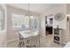 Bright dining area with modern table set and kitchen view, creating an inviting atmosphere at 5891 Welcome Rd # I6, Bradenton, FL 34207