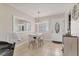 Dining room area with a modern table set and a large mirror on the wall at 5891 Welcome Rd # I6, Bradenton, FL 34207