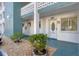 Property doorway showing the address and landscaping in front of the building at 5891 Welcome Rd # I6, Bradenton, FL 34207