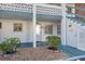 Property doorway showing the address and landscaping in front of the building at 5891 Welcome Rd # I6, Bradenton, FL 34207