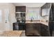 Well-equipped kitchen featuring stainless steel appliances, dark cabinetry, and ample counter space at 5891 Welcome Rd # I6, Bradenton, FL 34207