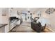 An open-concept living and dining area with views to the outside at 5891 Welcome Rd # I6, Bradenton, FL 34207