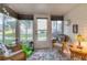 Enclosed sunroom/patio with wicker furniture and lots of natural light at 5891 Welcome Rd # I6, Bradenton, FL 34207