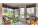 Relaxing sunroom/patio featuring wicker chairs, and a peaceful view of the outdoors at 5891 Welcome Rd # I6, Bradenton, FL 34207