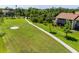 Aerial view highlighting the condo's proximity to the golf course and lush greenery at 6061 Fairway Ln # 1411, Bradenton, FL 34210