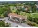 Aerial view of property with well-manicured landscaping and proximity to golf course at 6061 Fairway Ln # 1411, Bradenton, FL 34210