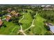 Scenic aerial view of Timber Creek Golf Course community featuring lush green fairways and mature trees at 6061 Fairway Ln # 1411, Bradenton, FL 34210
