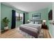 Stylishly decorated bedroom with large bed, soft rug, and ample natural light at 6061 Fairway Ln # 1411, Bradenton, FL 34210