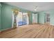 Spacious bedroom with hardwood floors and sliding glass doors with access to the lanai at 6061 Fairway Ln # 1411, Bradenton, FL 34210