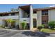 Condo exterior with manicured landscaping, private entry, and visible unit number at 6061 Fairway Ln # 1411, Bradenton, FL 34210