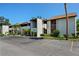 Exterior of the condos, manicured landscaping, and ample parking space available at 6061 Fairway Ln # 1411, Bradenton, FL 34210