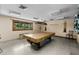 Game room with pool table, lighting, and a rustic wooden design at 6061 Fairway Ln # 1411, Bradenton, FL 34210