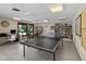 Fun game room featuring a ping pong table, computer, and book shelves at 6061 Fairway Ln # 1411, Bradenton, FL 34210