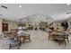Expansive great room with tile floors, stone fireplace, bar, piano and views at 6061 Fairway Ln # 1411, Bradenton, FL 34210